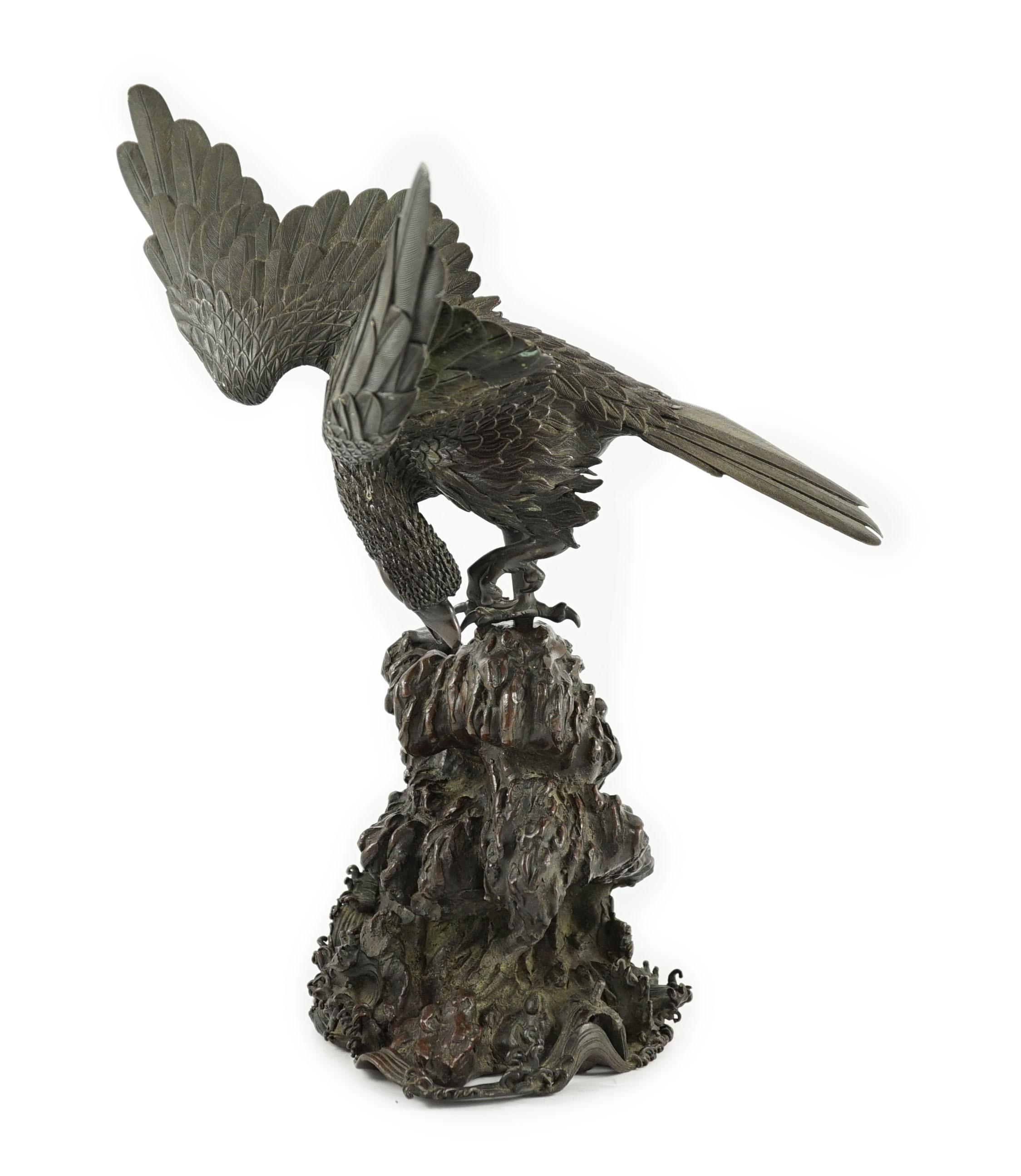 A Japanese bronze model an eagle standing on a rock, Meiji period, 44.5cm high